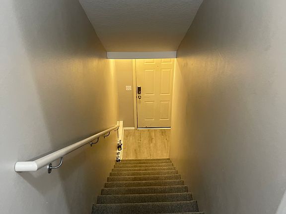 Staircase #1 from garage and front door to living area
