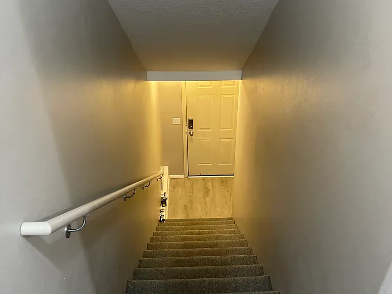 Staircase #1 from garage and front door to living area