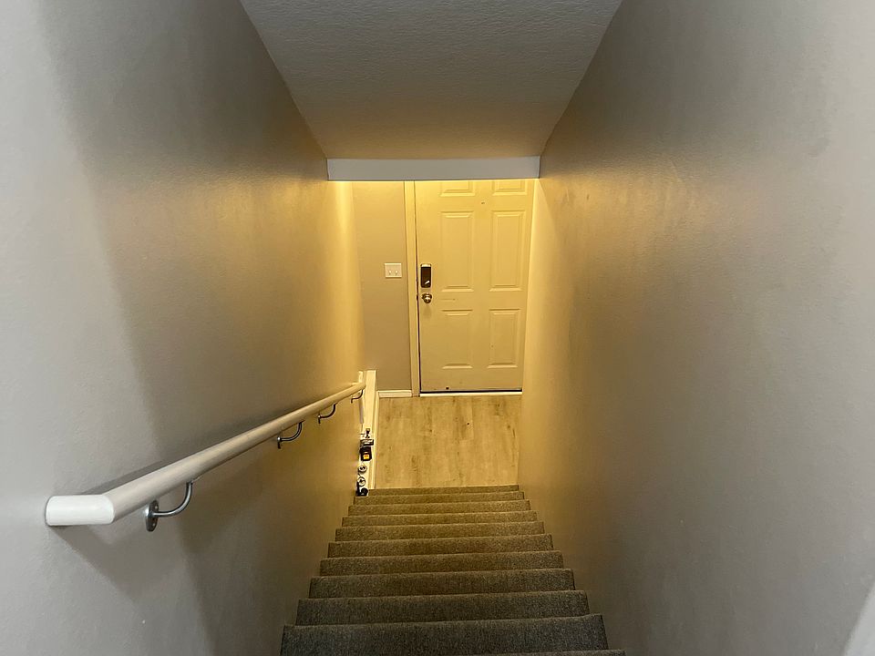 Staircase #1 from garage and front door to living area