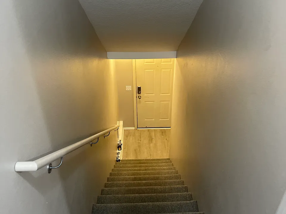 Staircase #1 from garage and front door to living area