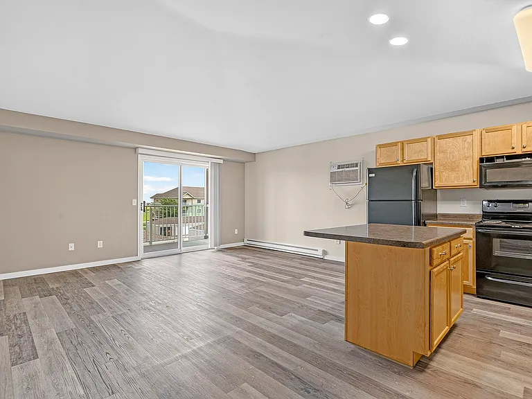 Elevate your living at Minot Place Apartments, where spacious layouts and modern finishes await. Enjoy natural light streaming through large windows, perfect for relaxation and entertaining. Explore your future home today!