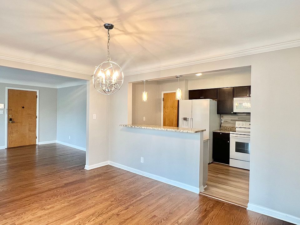 View of kitchen, dining room, living room
