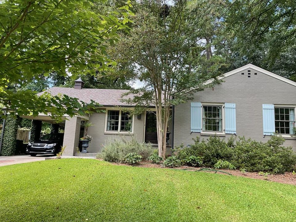 This charming renovation is set atop a hill on a quiet street in a friendly, walkable neighborhood. A carport and driveway parking pad provide off-street parking.