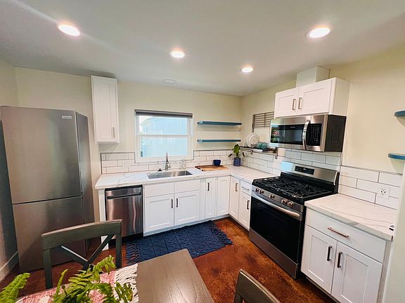 Enjoy a chefs kitchens/ gas stove all new stainless steel appliances .