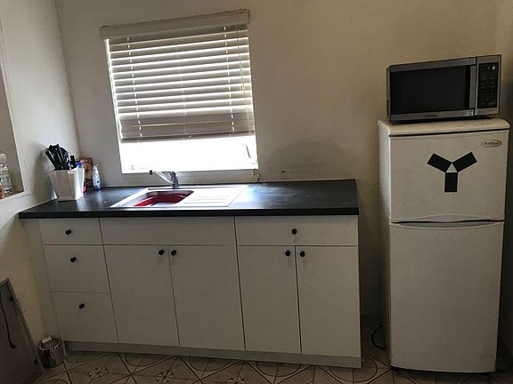 Kitchen with referigerator and microwave