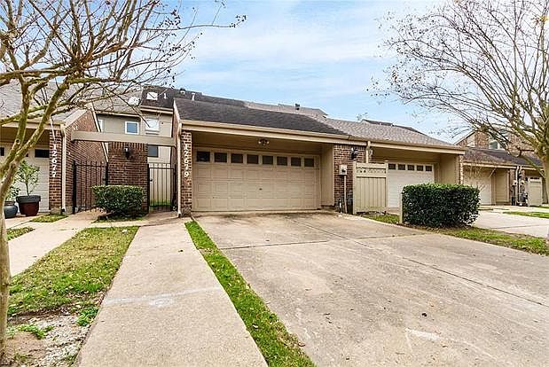 Street view - 2 Car garage & gated front entry