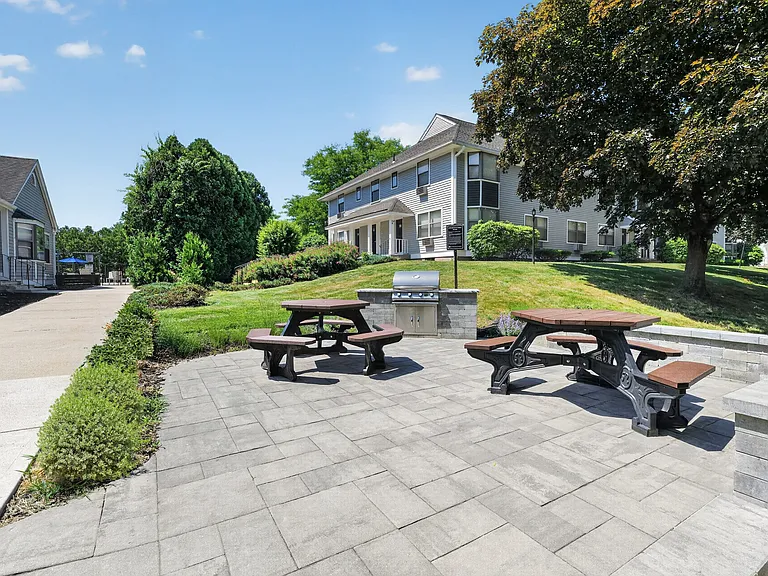 Eagle Rock Apartments at Enfield showcases serene outdoor spaces perfect for relaxation and gatherings. Enjoy beautifully landscaped areas with picnic benches, ideal for time with friends or solitude. Explore your new lifestyle today!