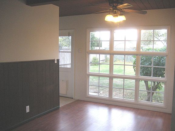 Dining room view to back yard. Kitchen to the left.
