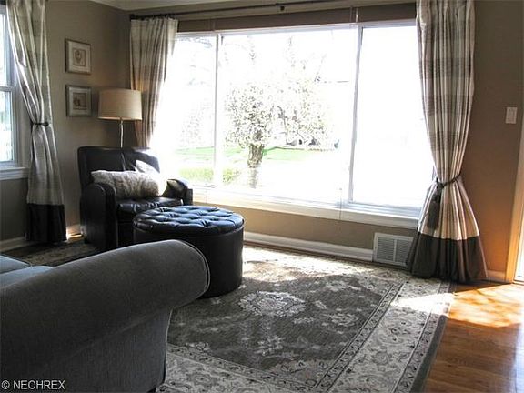 *Picture perfect window with pretty window treatments in the living room.
