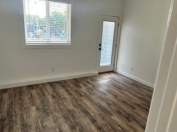 large bedroom with door to backyard