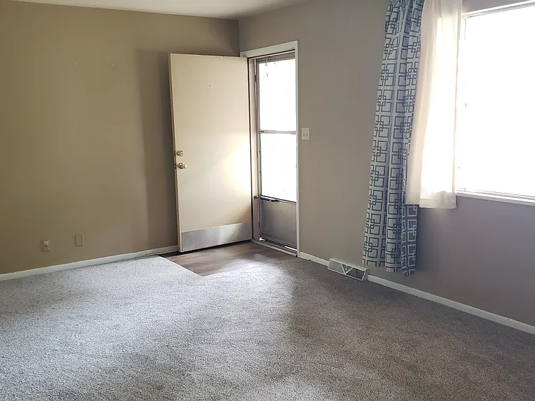 Large living room! That's light coming in from the West. New carpet as of Oct 2025.