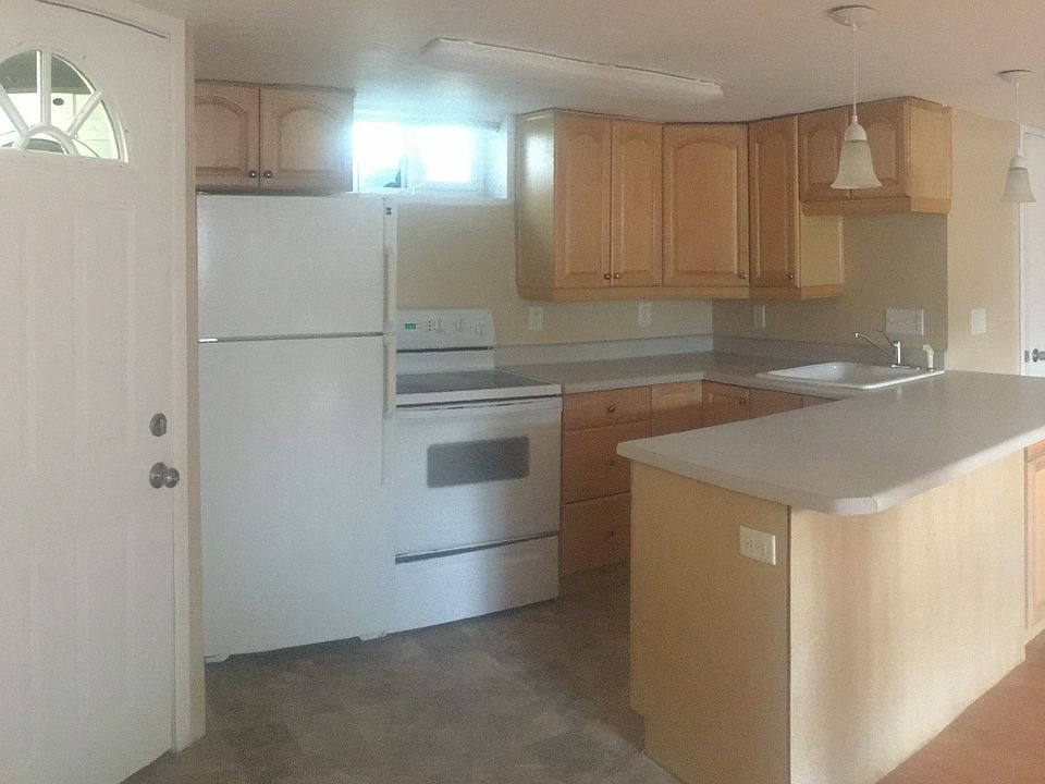 The living room flooring in this photo is old, but shows the natural light.