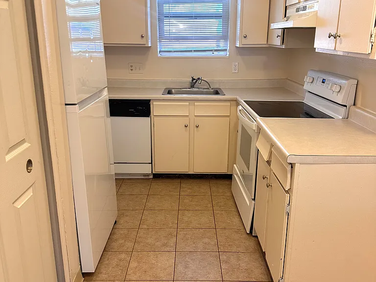 Kitchen features all appliances including dishwasher