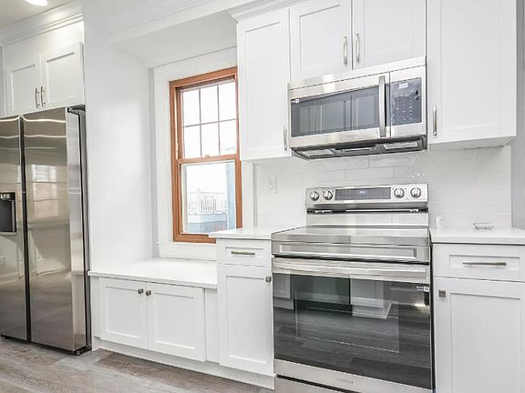 Enjoy cooking in a modern kitchen featuring beautiful new appliances.