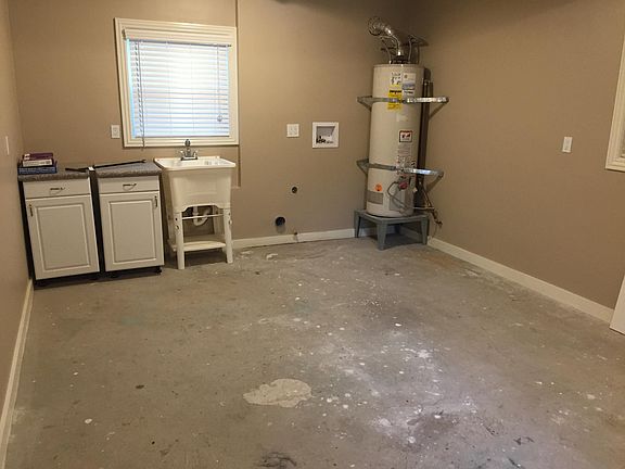 Laundry/storage room on ground level.