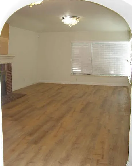 Spacious living room with hardwood floors