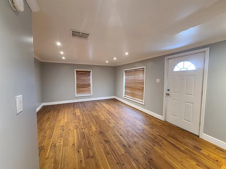 Large living room with new flooring.