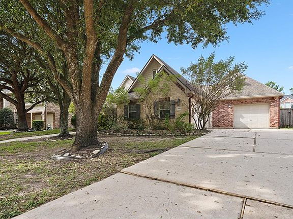 The home has a 3 car garage and a dual wide driveway.