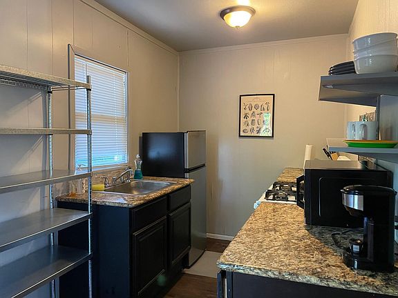 Kitchen with granite countertops.