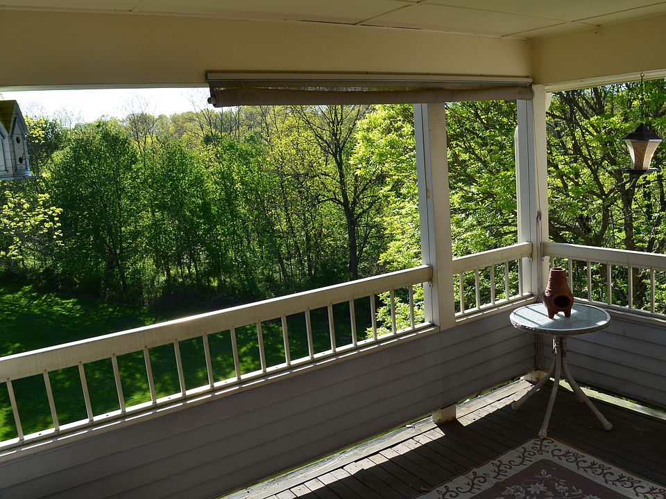 Covered deck overlooking wooded views