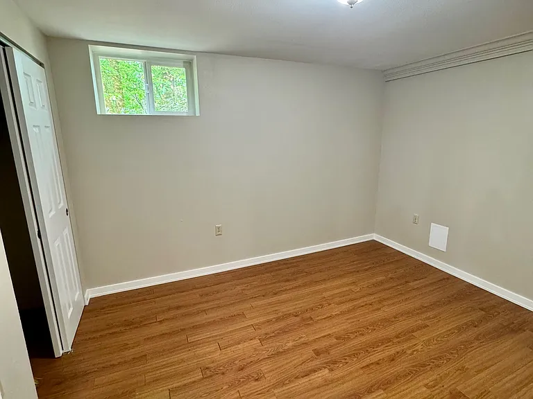 Bedroom with New Vinyl window and fresh paint.