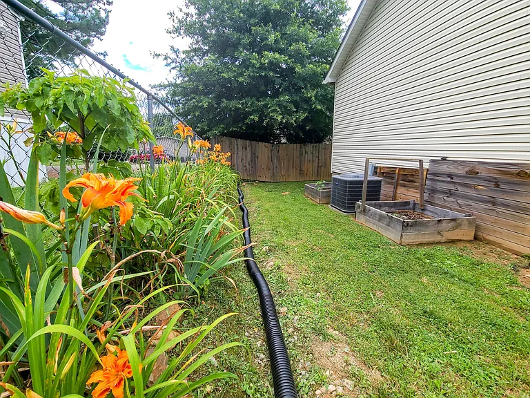 Flowers and room to play! Please note: the back retaining wall is under construction due to the national shortage of construction materials. The backyard is a great play place, otherwise!