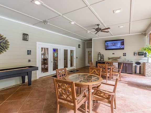 Poolside entertainment area with kitchen