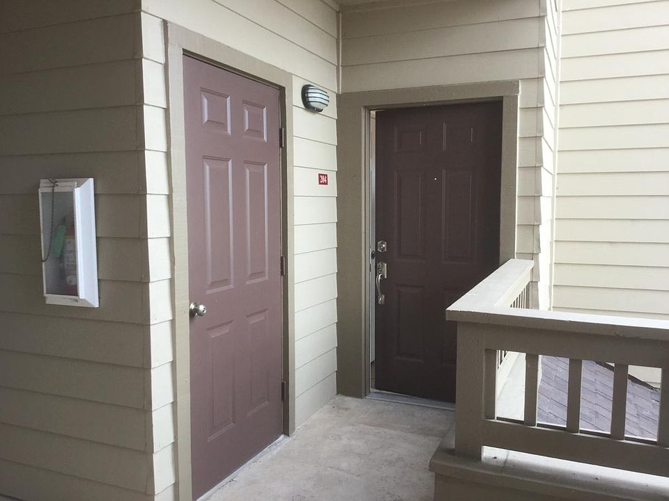 Condo entry with storage closet door on left.