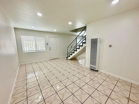 Unwind or entertain comfortably in your expansive living room, equipped with a new, quiet, high-efficiency AC unit