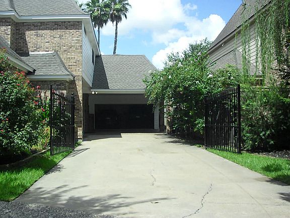 Gated driveway for extra privacy! Super long  double wide driveway where you can park up to 5 vehicles! Circular driveway in front of residence!
