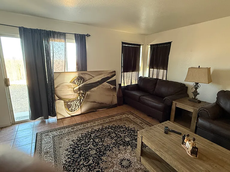 Large family room. (Tenant in process of moving.)