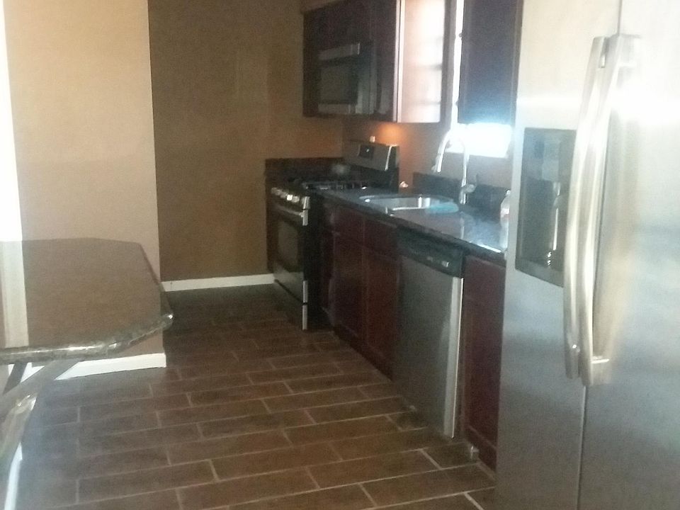 Kitchen stainless steel appliances , bar countertop ,granite countertops