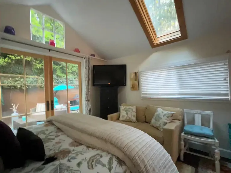 Sofa, TV, and dresser.