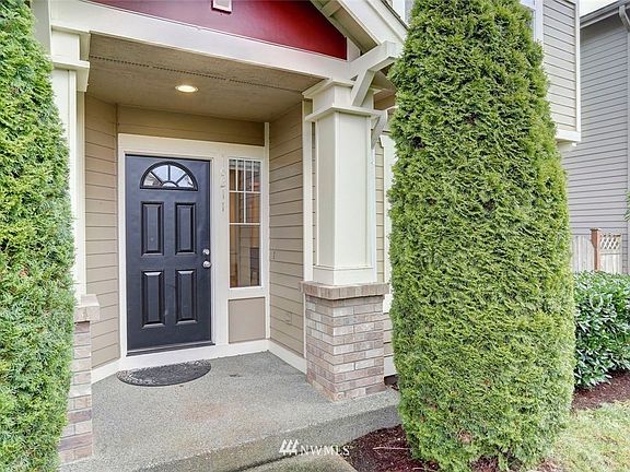 Welcoming entryway with gracious covered porch