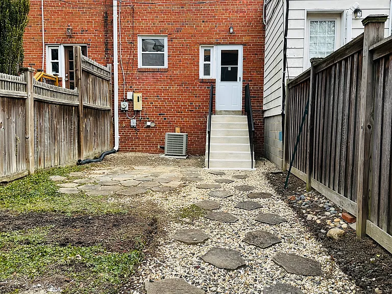 Neat and clean backyard with 6' fence! Hardscape for minimal maintenance!