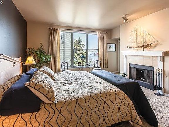 Primary Bedroom River Front Views and Fireplace