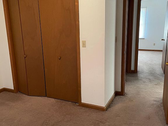 view from back bedroom through short hall to front bedroom