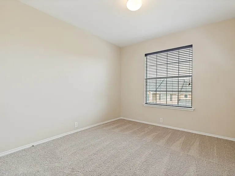 Upstairs front facing bedroom.