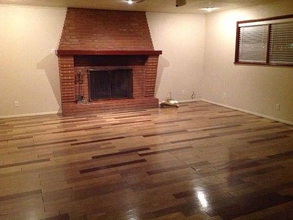 Very Large Living Room with Brick Fireplace