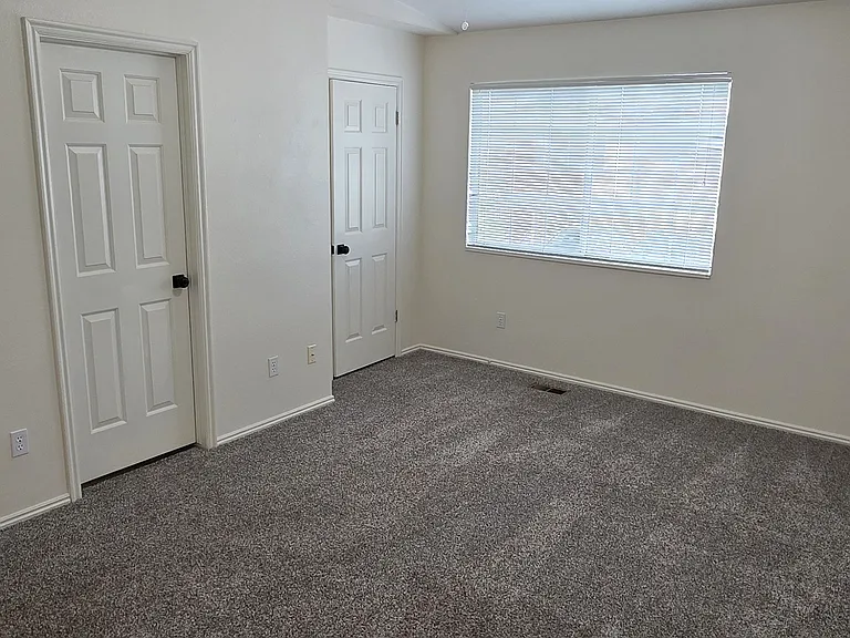 PRIMARY BEDROOM WITH SECOND CLOSET, AND ENTRY TO FULL BATHROOM