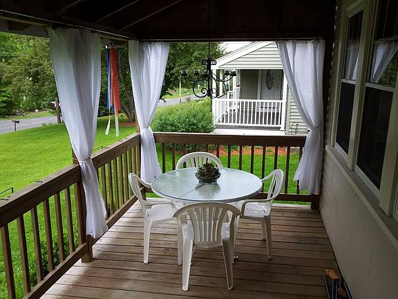 Back covered porch, off from living room.