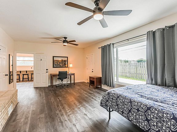 Minisplit AC, queen bed, hybrid mattress, night stand, full length mirror, and desk with chair. 2 fans with remotes.