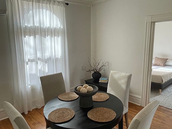 Kitchen, downstairs bathroom and a bedroom connect to dining area