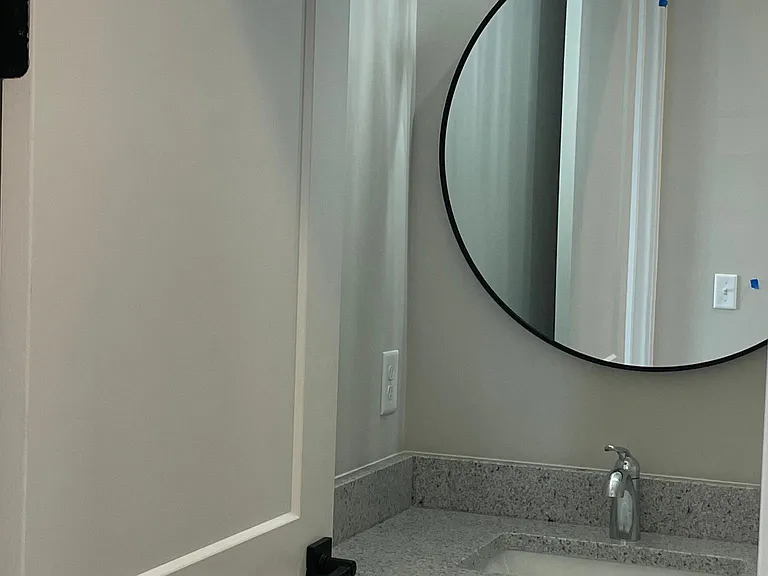 Guest Bath with Granite countertops, Custom Lighting and Mirror