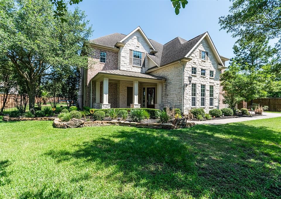Mature landscaping surround this beautiful property nestled on over a 1/2 acre lot.