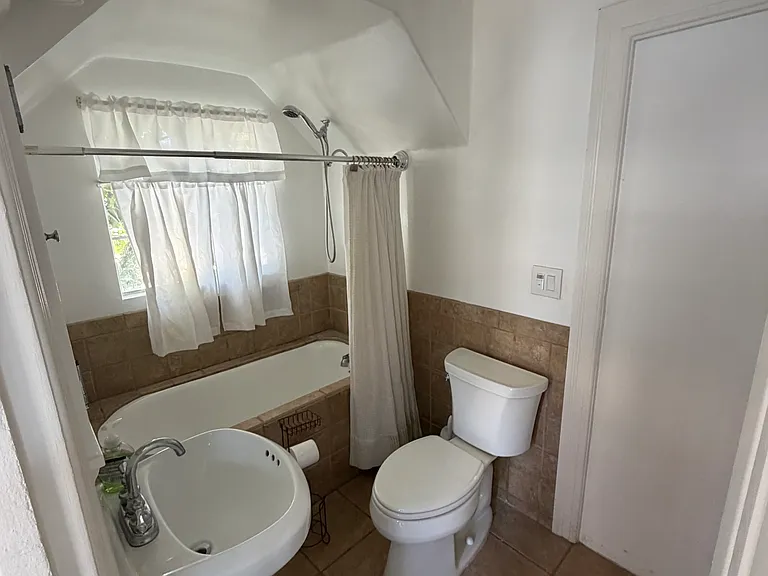Bathroom with tub/shower.
