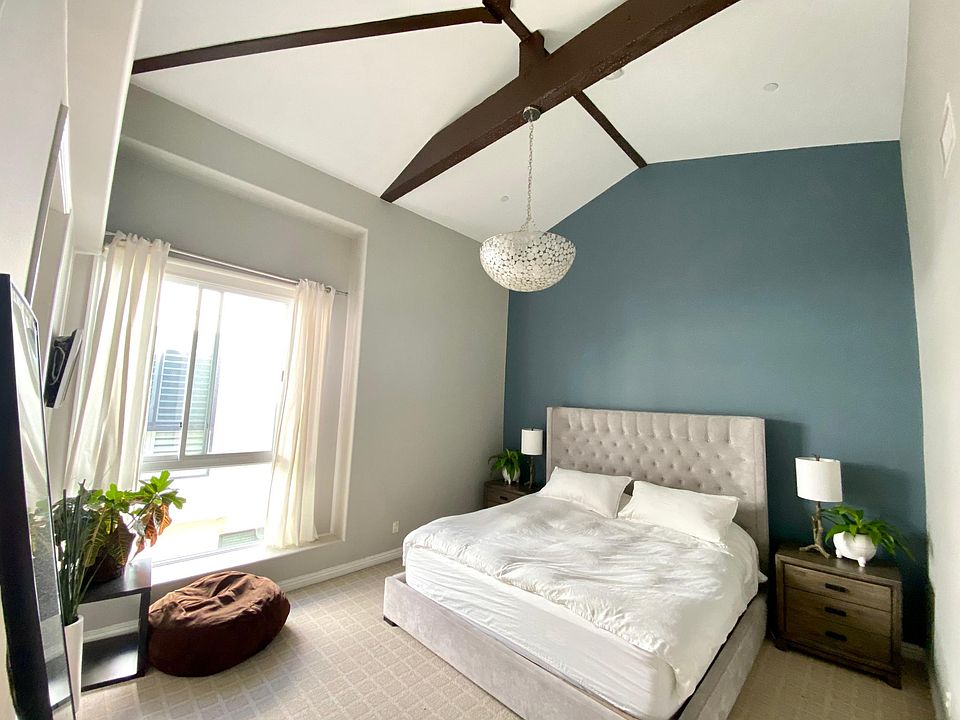 Master bedroom with vaulted ceilings