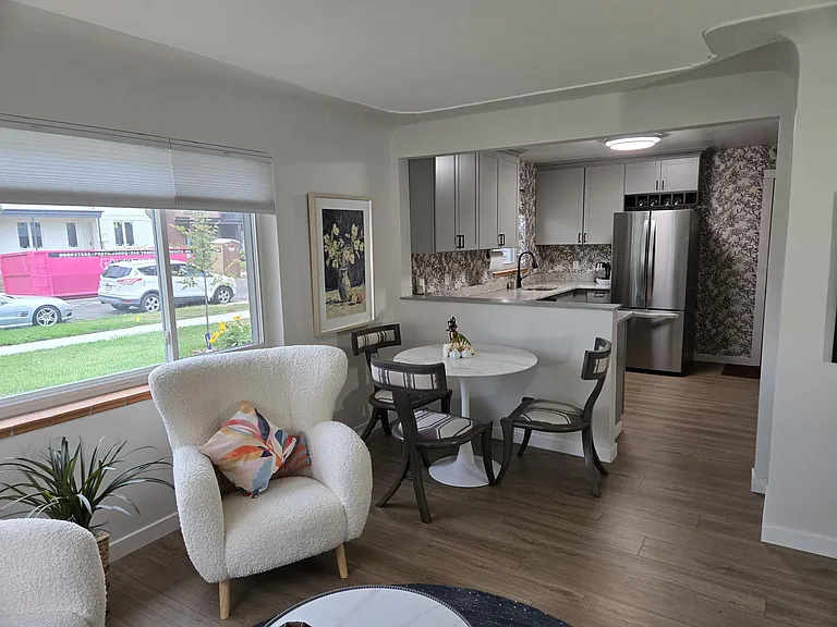 The entire house was gutted and remolded this summer. The open plan gives an expansive feel to the space. All new paint, floors, shades and fixtures provides a neutral cohesively decorated space for your furniture to fit in to.