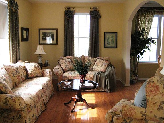 Sunny Living Room with Arched entrance to Dining Room