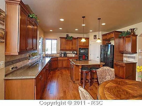 hickory hardwood floor and full granite counters, custom builder's upgrades